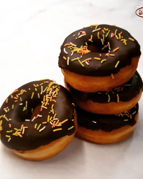Sometimes, the simplest things bring the most joy. Our classic chocolate donuts, topped with colourful sprinkles, are soft, fresh, and a favourite treat for kids and the young at heart.