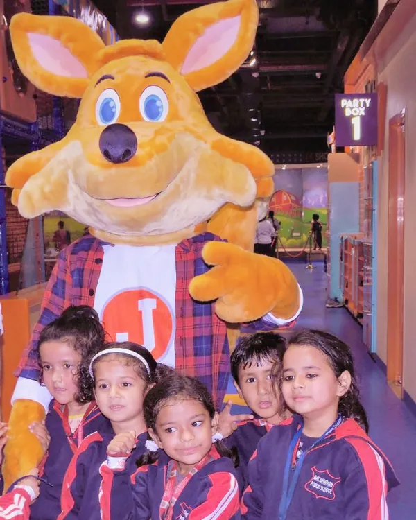 Students from a local school pose for a group photo with our mascot, J the Fox, during their field trip. We love hosting school groups for a day of fun.