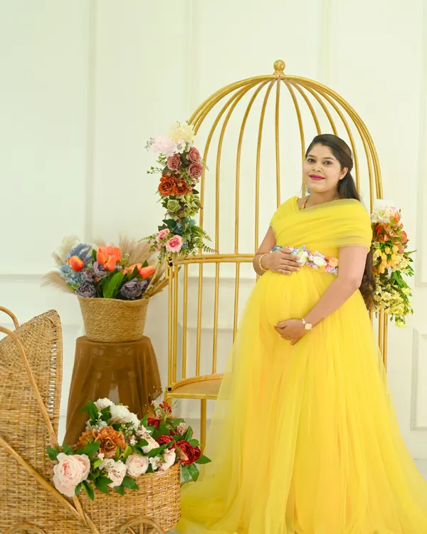 A classic solo portrait in my studio. The bright yellow gown looks so cheerful against this elegant setup with the golden birdcage and floral arrangements.