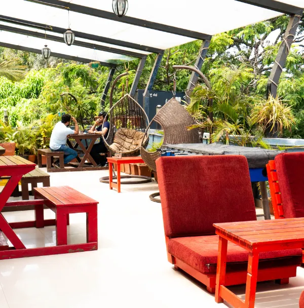 Welcome to your new favorite spot. This is my green rooftop terrace, a little slice of paradise where you can work, relax, and connect with others, surrounded by plants and open sky.