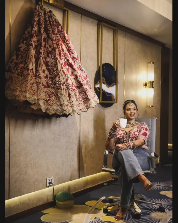 This picture is so me. A quiet moment with my chai, dressed in my bridal blouse and comfy jeans, with my wedding lehenga hanging right there. It shows my philosophy perfectly: styling is about blending the grand with the personal, ensuring you feel comfortable and true to yourself even on your biggest day.