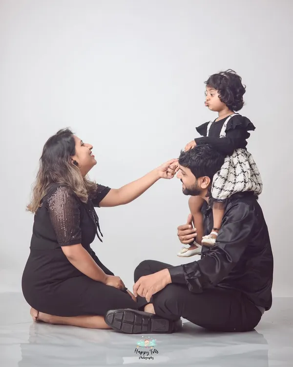 A perfect family moment. We love capturing the joy and playfulness between parents and their children, like this sweet shoulder-ride pose.
