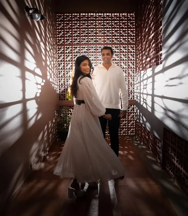 A creative portrait using dramatic shadows from a lattice wall. I love finding unique architectural details and using light to create artistic and memorable pre-wedding photos.