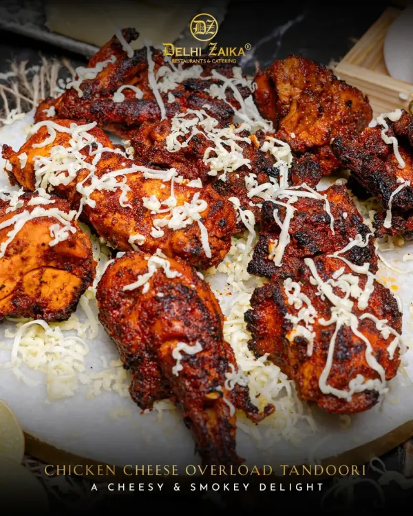 Our Chicken Cheese Overload Tandoori is a true indulgence. Juicy, smoky tandoori chicken pieces are generously topped with shredded cheese for a cheesy, spicy delight.