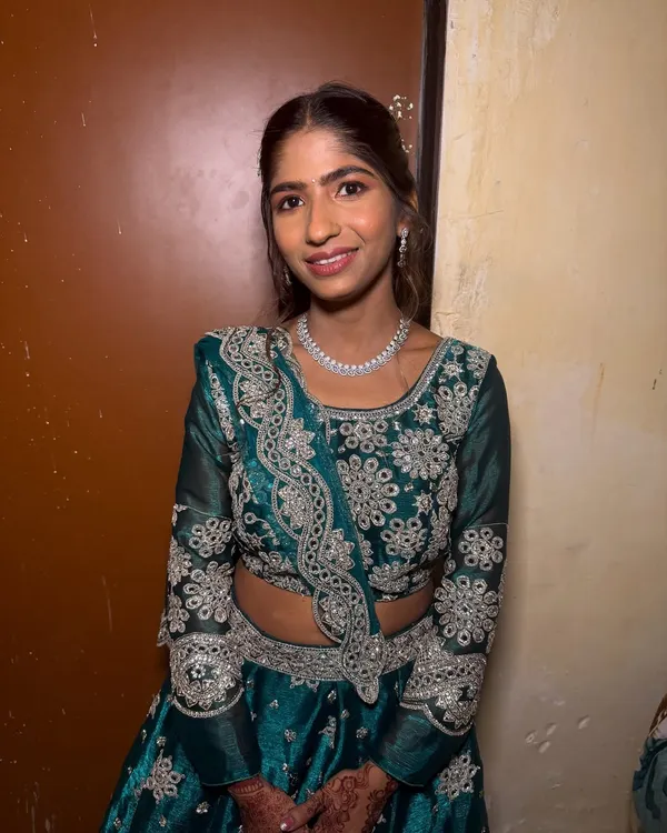A beautiful bridesmaid look. I gave her a soft, natural makeup look and a simple half-up hairstyle with a small floral accessory.