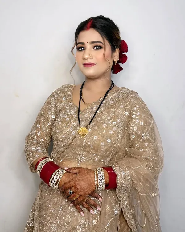 The bride's best friend looking stunning. I gave her a soft glam look with a classic red bindi and roses in her hair.