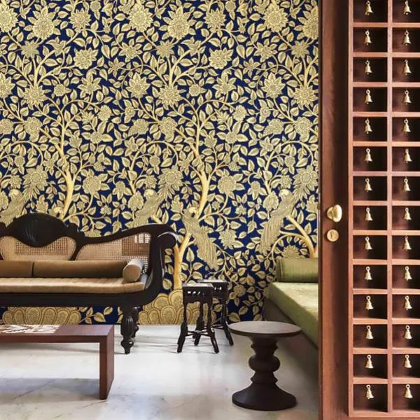 This is the kind of grandeur we bring to your walls. A design from our Prakriti collection, featuring the traditional Tree of Life motif in stunning gold on a deep blue base, creating a truly royal and welcoming atmosphere in this living space.