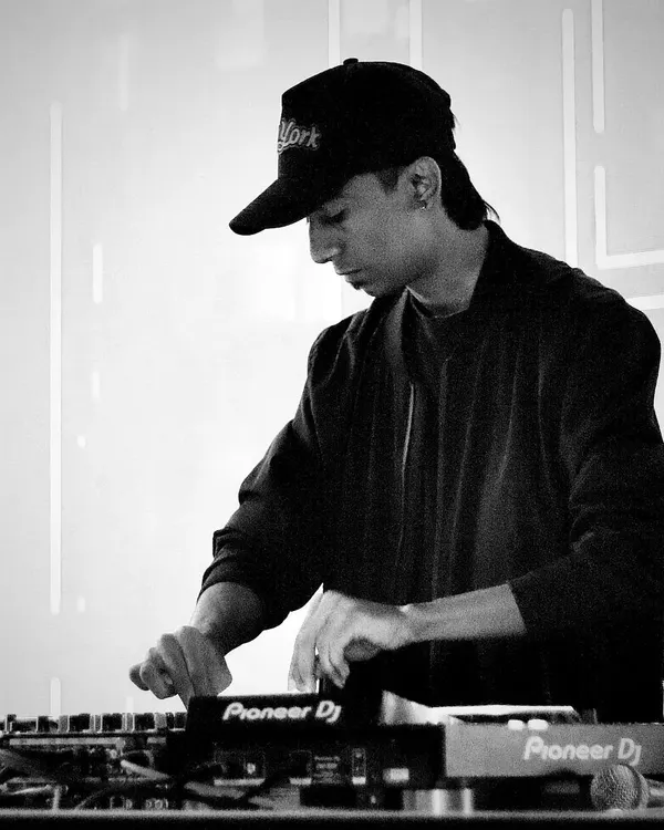 In the zone, focused on crafting the perfect mix. Every transition and track selection is done with care to maintain the party's energy flow.