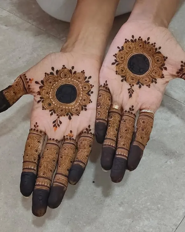 A beautiful mandala design with a dark center, creating a bold and striking look.