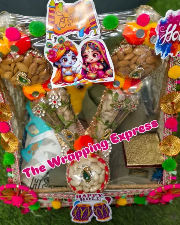 A vibrant Holi hamper decorated with Radha-Krishna stickers. This basket includes clothes, dry fruits in decorative cones, and other festive items.