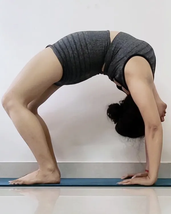 Chakrasana, or Wheel Pose, is a deep backbend that opens the chest and lungs, strengthens the entire back of the body, and boosts energy. It's a powerful heart-opening asana.