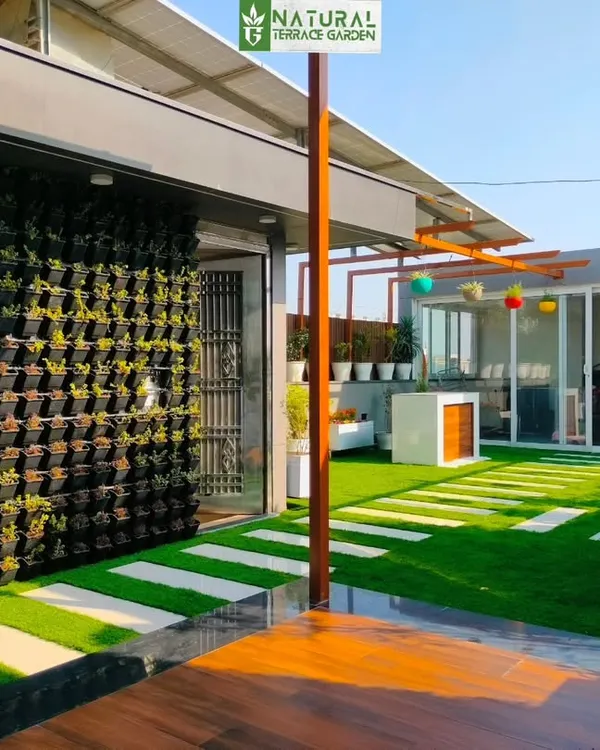 A large vertical garden installed at our Sonipat project, creating a massive green wall that acts as a stunning, living backdrop.