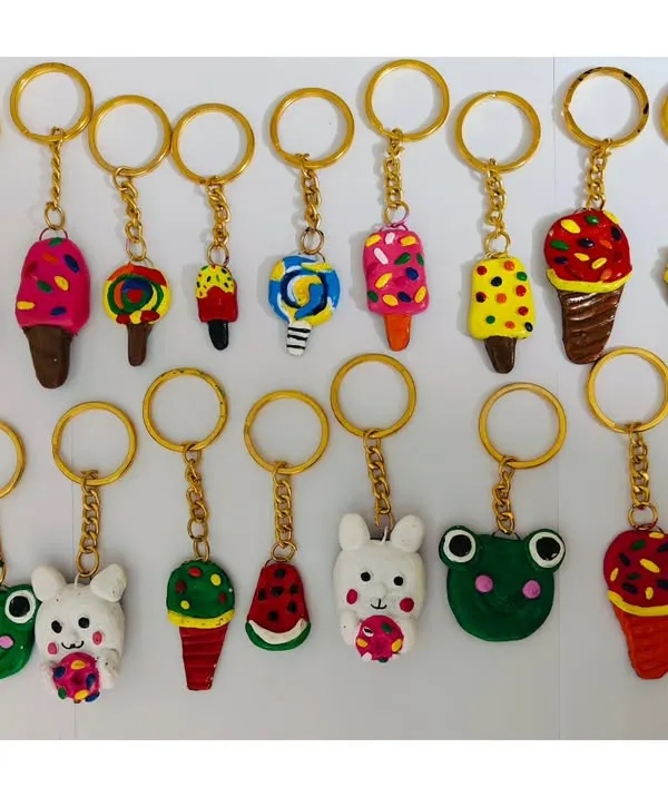 Look at these adorable clay keychains made by our campers! Each one is unique, from cute animals to colorful ice cream cones, showing the amazing creativity of our little artists.