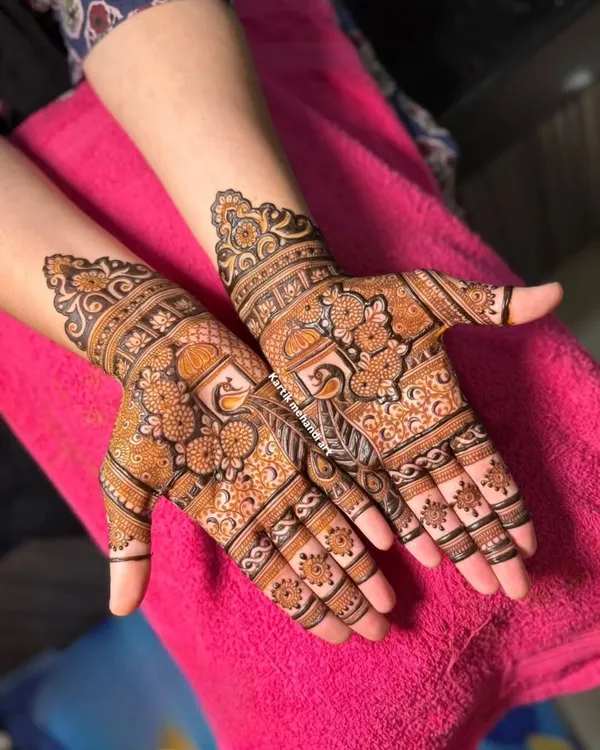 A trial session is the perfect way to finalize your bridal design. This piece shows a detailed palanquin (doli) motif, allowing the client to see our artistry upfront.