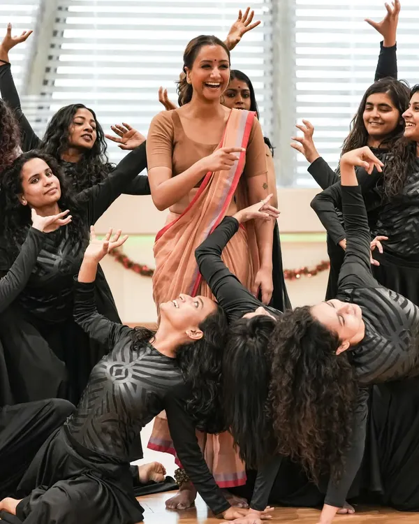 A joyful moment on stage, surrounded by my students during a performance. The connection between a teacher and students is truly special, and it shines during a showcase.