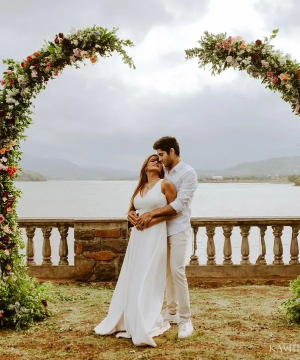A beautiful pre-wedding portrait session by the lake, framed by a stunning floral arch. I love creating these grand, scenic shots that feel like a fairytale.