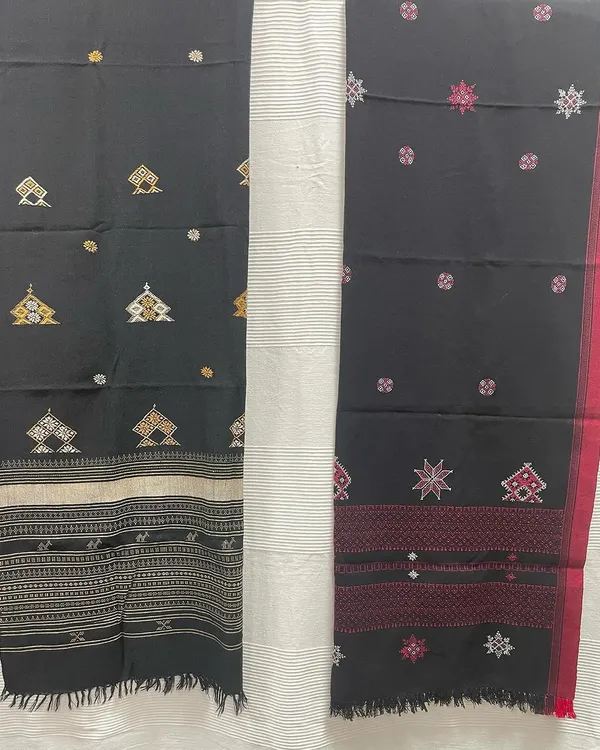 Get ready for winter with these hand-embroidered woollen shawls. This image shows two distinct designs, both featuring a combination of Kasuti and Negi embroidery on black wool.