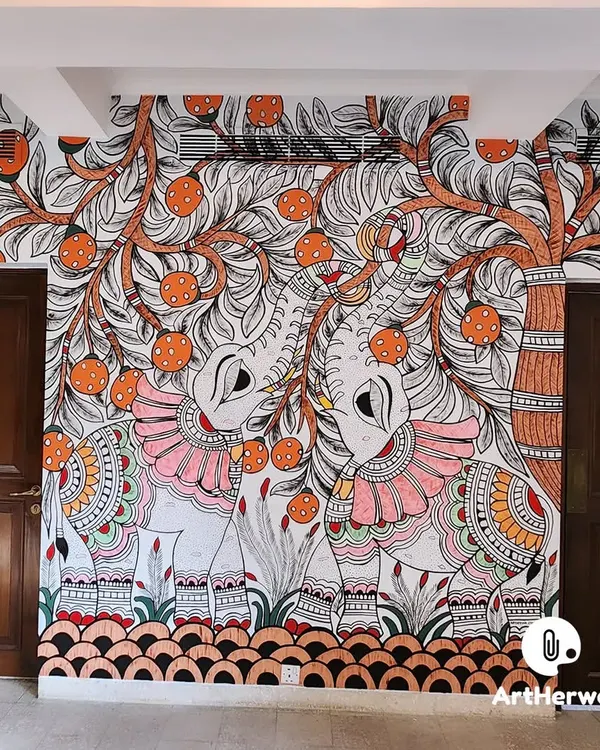 This hand-painted Madhubani mural brings traditional Indian folk art to life in a modern home. We meticulously designed and painted this piece, featuring two elephants under a fruit tree, to create a stunning and culturally rich focal point between the doorways.