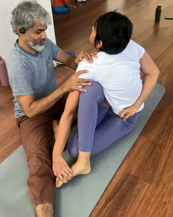 (Hero Item) Our Teacher Training Course is built on a foundation of direct guidance. Here, we work closely with a student on Purna Ardha Matsyendrasana, focusing on the subtle mechanics of a deep spinal twist. This hands-on approach ensures you not only learn the posture but also understand the anatomy and alignment needed to teach it safely and effectively.