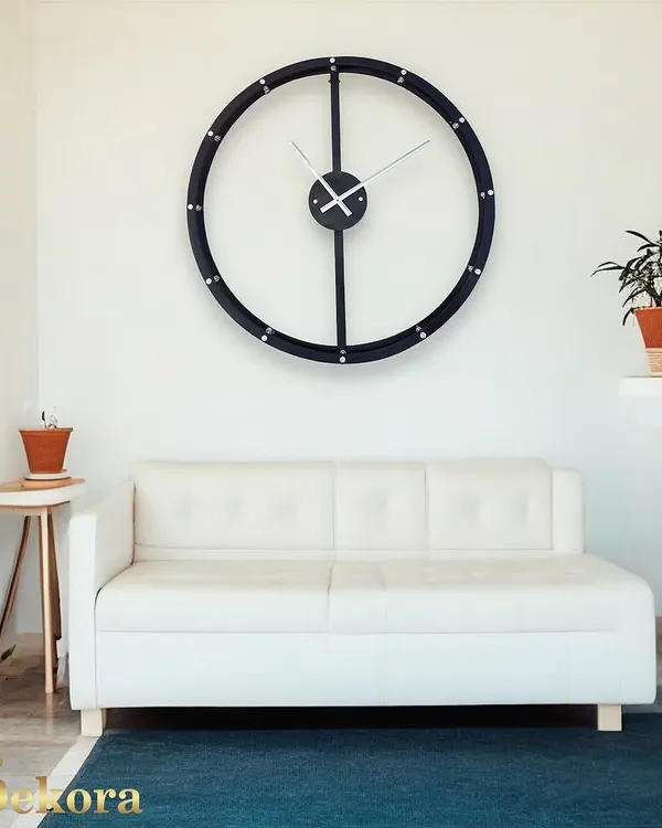 This creative wall decor clock features a large, simple black ring, embodying minimalist design for a modern living space.
