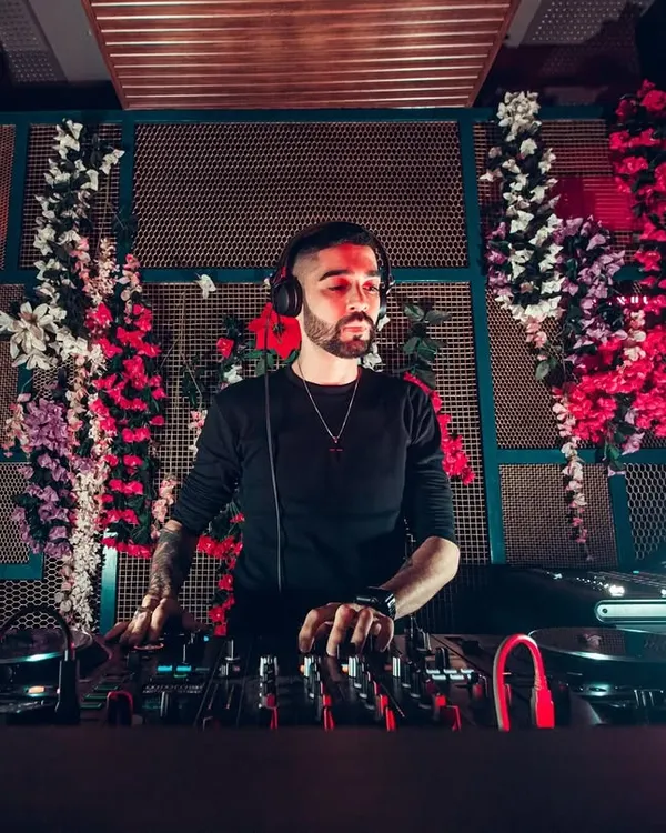 This is me in my element, focused on the mix at a private event. I use top-of-the-line Pioneer DJ equipment to ensure the sound is perfect and the transitions are seamless, creating a non-stop musical journey for my clients.