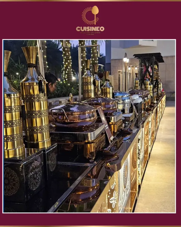 This is what a celebration catered by us looks like. We design grand buffet experiences with meticulous attention to detail, from the ornate serving dishes to the ambient lighting, ensuring your event feels as spectacular as it tastes.