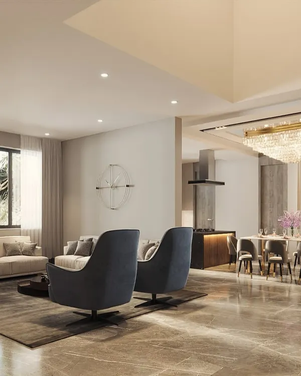 An open-concept living and dining area designed for seamless flow and connection. I used a neutral color palette with statement furniture pieces and a grand chandelier to define the dining space within the larger room.