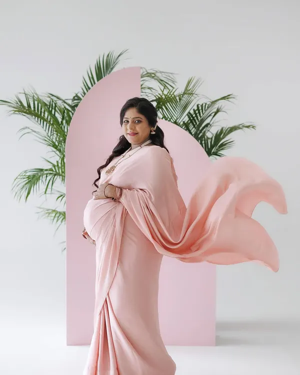 A beautiful, ethereal shot from a maternity session. The mom-to-be is wearing a flowing pink saree, and I created a soft glam makeup look with pink eyeshadow and a matching lip to complement her outfit. The flowing fabric adds a lovely sense of movement.
