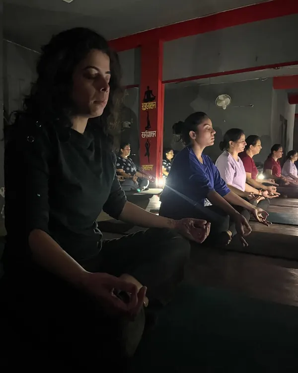 In the quiet of the studio, we turn inward. Meditation is a practice of observing the mind and finding stillness, a key tool for managing stress.