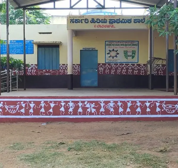 The completed Warli art border on the stage of a government school. This project was about bringing traditional Indian folk art to the children, creating an inspiring and culturally rich environment.