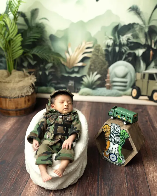 Our little patriot, dreaming big dreams. This army-themed photoshoot is a wonderful way to honor a family's service or simply create a unique and strong portrait of your newborn.