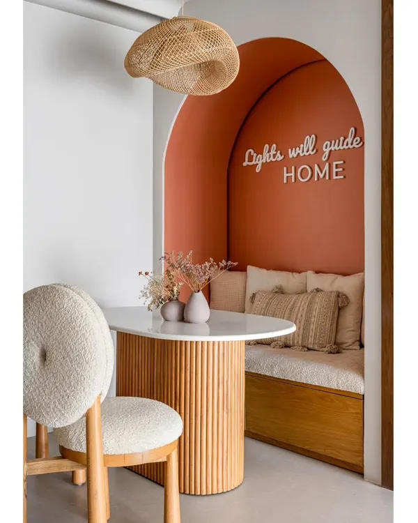 This cozy dining nook is one of my favorite creations. The custom neon sign, "Lights will guide you HOME," is all about creating a space that feels personal and warm, a little corner of the world that’s just for you.