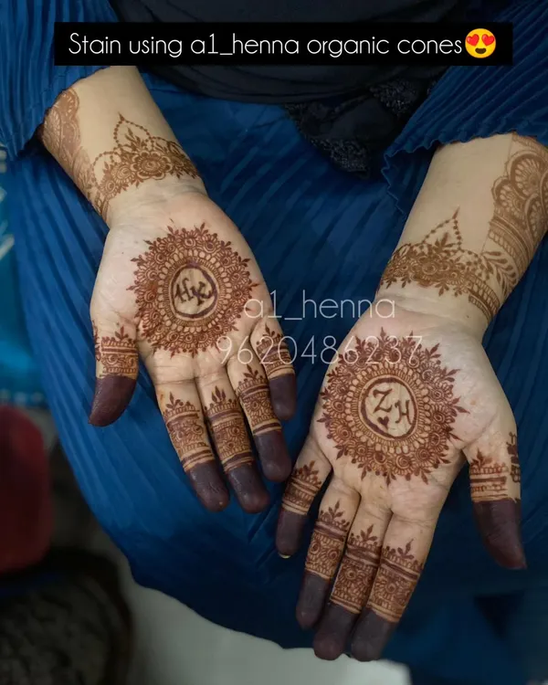 A beautiful example of personalization, with the initials 'A' and 'ZH' incorporated into the center of traditional mandala designs.