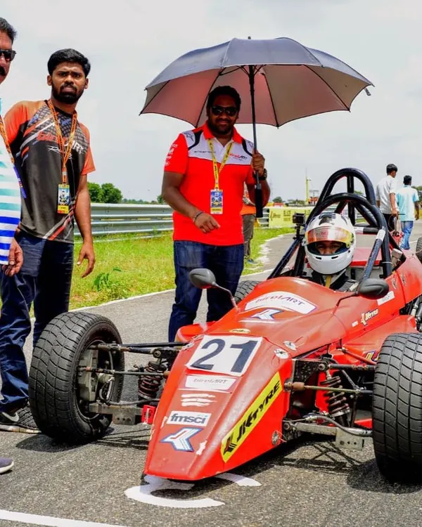 Our driver Mihir Avalakki on the starting grid in his Formula LGB car, with our team providing support right before the race begins.