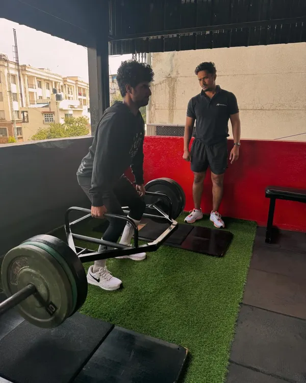 We believe in building strength from the ground up. Here, I'm guiding a client through a trap bar deadlift, ensuring perfect form to maximize power output and prevent injury.