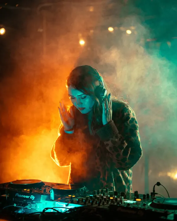 Lost in the mix, surrounded by smoke and lights. This is my element, where I connect with the music and the crowd on another level, using professional Pioneer DJ gear to craft the perfect hard techno set.