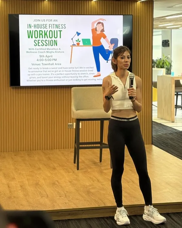 Leading a corporate wellness session. As someone who comes from a corporate background, I'm passionate about bringing fitness into the workplace. Just 30 minutes a day can transform your energy and focus.