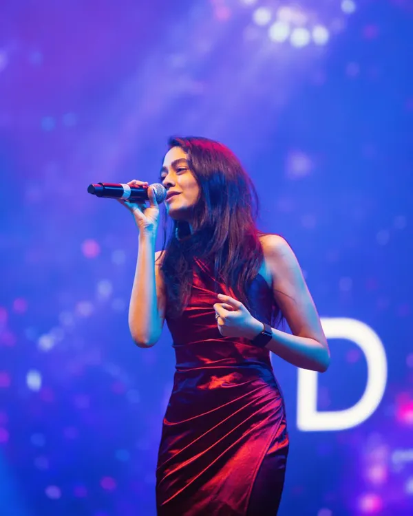 This is me in my element, lost in the music on stage. I love connecting with the audience and creating a vibe, whether it's for a huge concert or a private wedding performance.