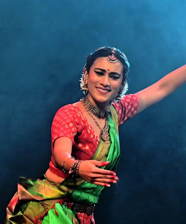 A joyful moment captured during a performance at the NCPA in Mumbai. The vibrant costume, traditional jewelry, and expressive smile showcase the celebratory spirit of classical dance.