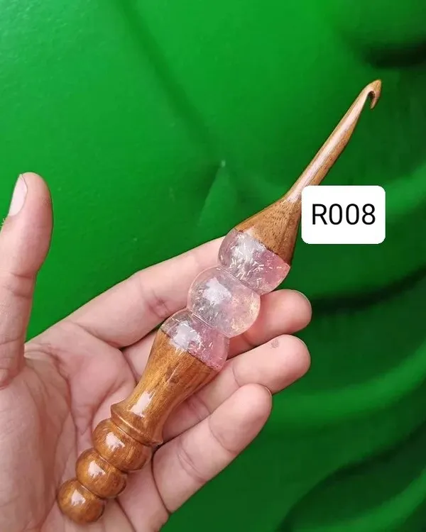 This is one of my favorite handcrafted hooks. It combines a smooth wooden shaft with a beautiful, ergonomic resin handle that makes crocheting for hours super comfortable. Each one is unique and made with a lot of love.