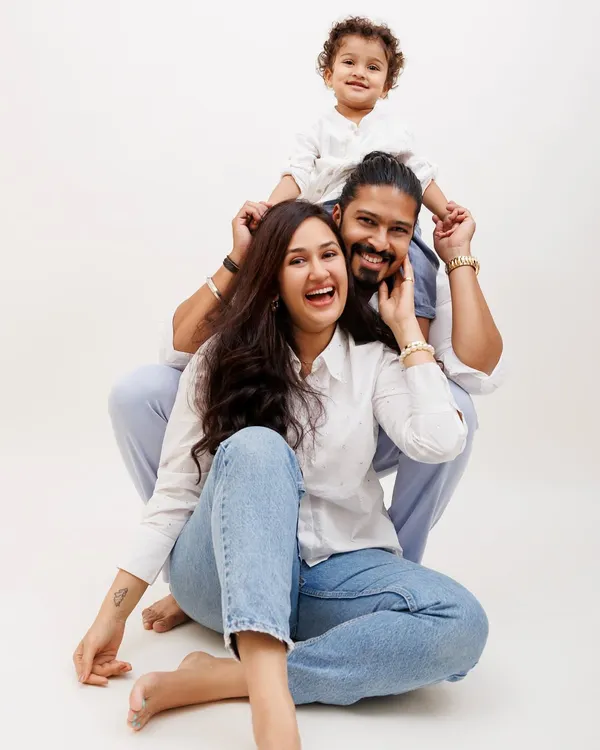 This is what pure happiness looks like. My studio sessions are all about creating a relaxed space where you can laugh, play, and just be yourselves. I aim to capture these genuine, candid family moments that you'll treasure as timeless wall art.