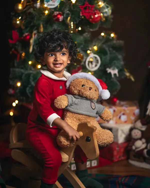 The pure joy of a child on a rocking horse, surrounded by the warm glow of Christmas. These sessions are all about capturing the wonder and excitement of the holiday season.