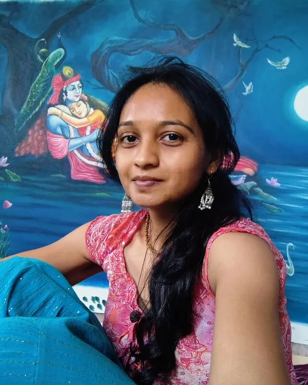 Me with my Radha Krishna moonlight painting. These moments after finishing a piece are so special... a quiet connection with the art before it goes to its new home. Happy Kojagiri Poornima. 😇