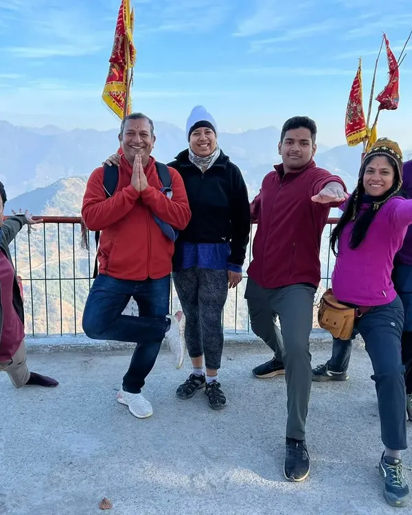 A beautiful moment from our Rishikesh retreat. We practice various asanas like Vrikshasana and Virabhadrasana together, overlooking the majestic mountains.