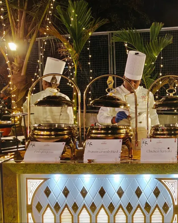 Our chefs are hard at work at a beautifully lit outdoor wedding. We use premium, illuminated buffet counters and traditional brass serving dishes to create a luxurious feel for your celebration.