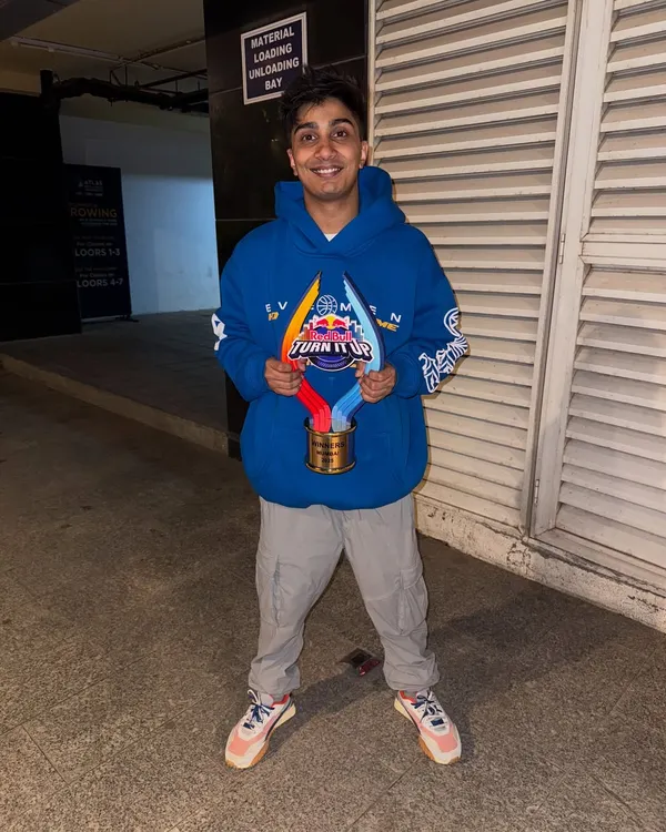 Holding my first-ever award from the Red Bull "Turn It Up" competition. A proud moment and a big thank you to everyone who supported me.