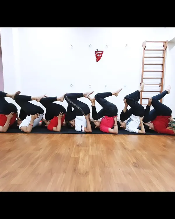 Our students celebrating Christmas with a creative group yoga pose. We believe in finding joy and connection in our practice.