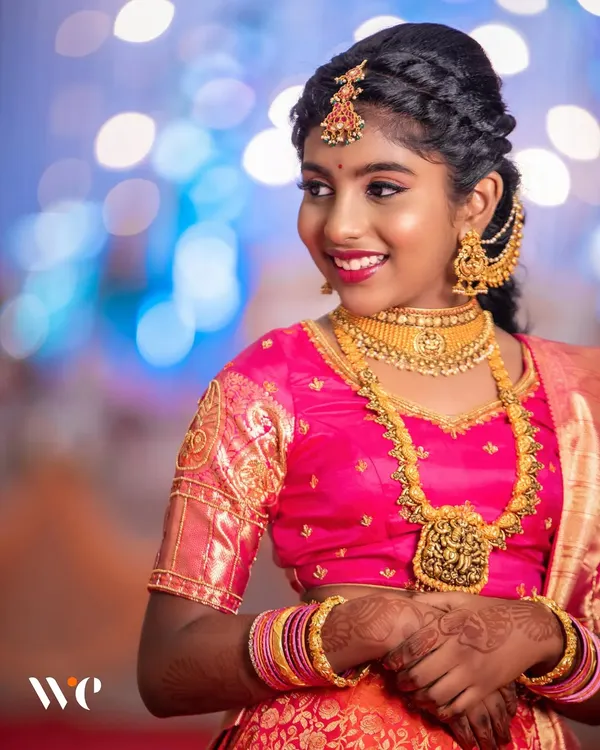 We believe in creating timeless portraits that celebrate life's biggest milestones. This shot from a traditional half-saree ceremony shows our expertise in using lighting and composition to capture pure joy and elegance.