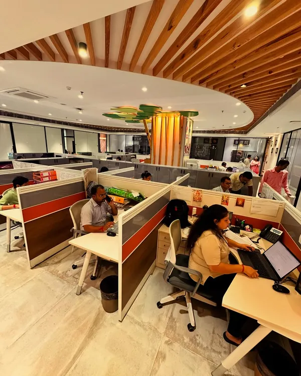 This is the heart of an office I designed for a sustainable paper company. Instead of hiding a structural column, I transformed it into a 'tree of ideas'. The design is a direct reflection of their company ethos of planting more trees than they use, symbolizing growth, creativity, and rooted values.