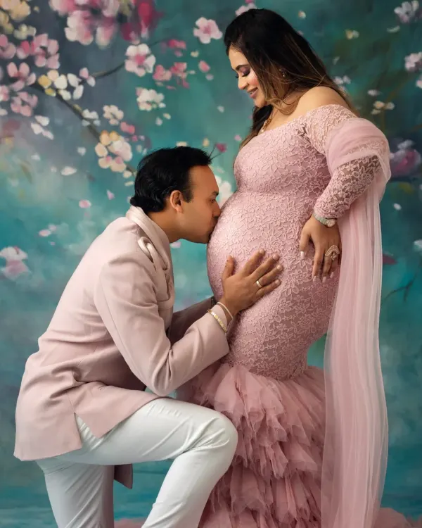 This is what it's all about. Capturing that pure love and anticipation between partners as you wait for your little one. This couple's connection in their coordinated pink outfits for their studio maternity shoot was just beautiful.